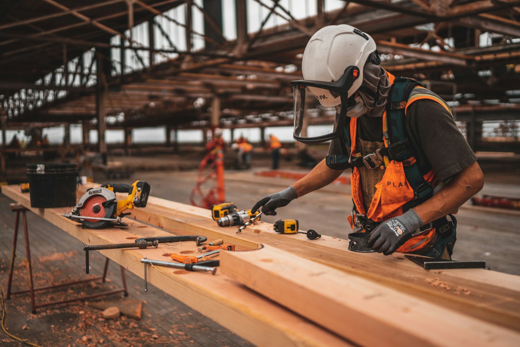 Worker with a power tool