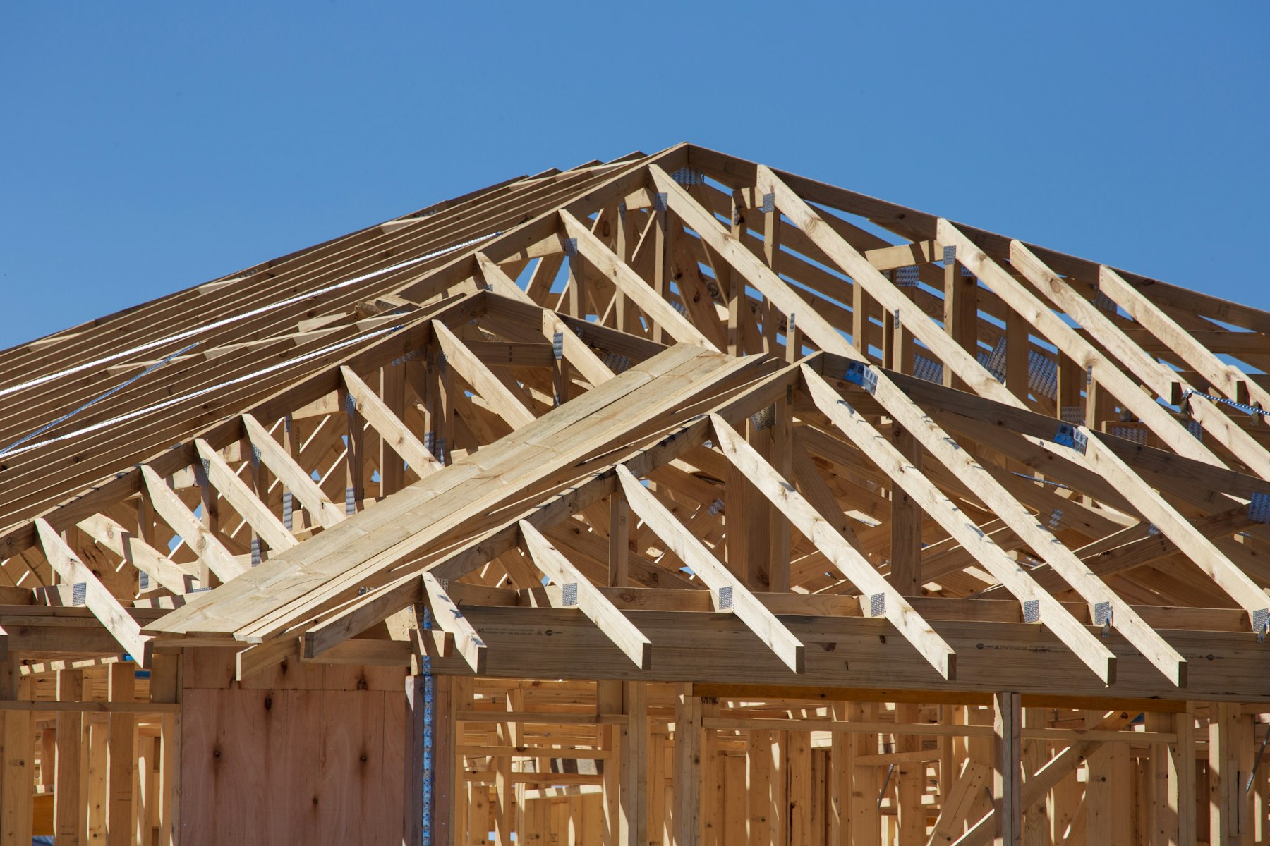 House under construction with wooden wall framing